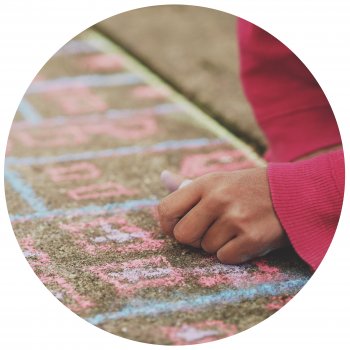 Kid drawing with chalk